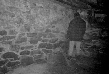 screencap of a person standing in a corner, taken from The Blair Witch Project